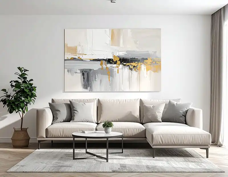 Cuadros decorativos grandes en el salón sobre un sofá